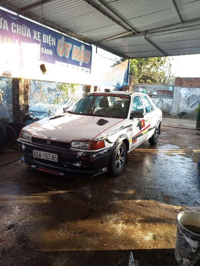 Mazda 323 Trắng 2000km