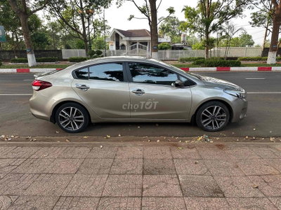gd cần bán Kia Cerato 2016 STD Luxury Vàng cát