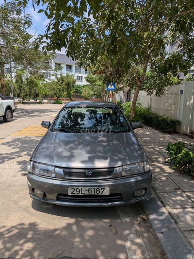 Mazda 323 màu Xám