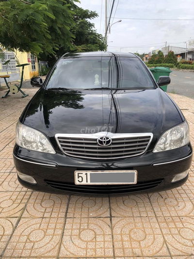 Toyota Camry 3.0V model 2004 màu đen cọp